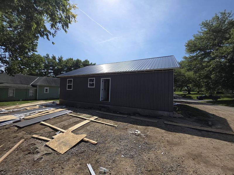 Metal roof on a new home viewed from the side of the lot